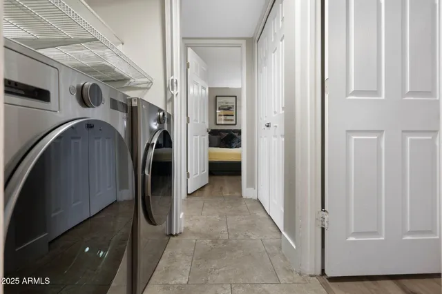 a view of a storage & utility room with washer and dryer
