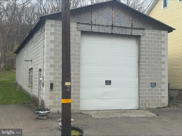 a front view of a house with garage