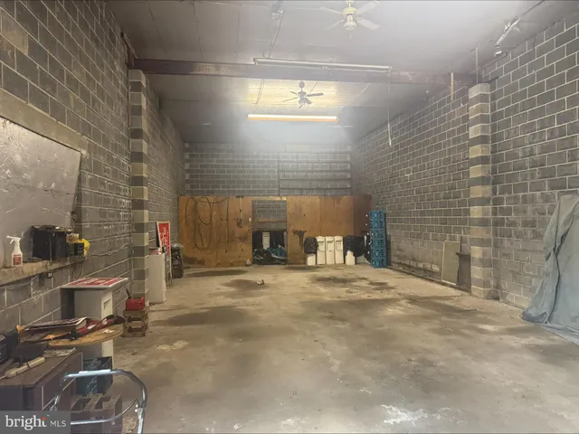 a brick house with garden in front of it