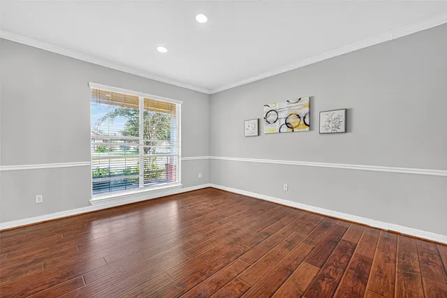 a view of room with wooden floor and window
