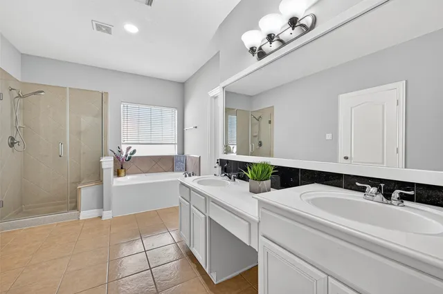 a kitchen with a sink cabinets and window