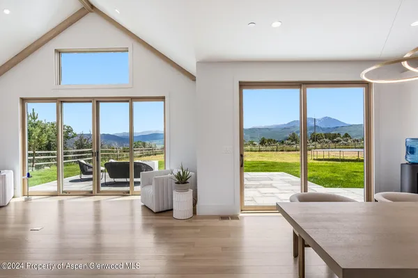 a kitchen with stainless steel appliances granite countertop a sink a stove and a refrigerator