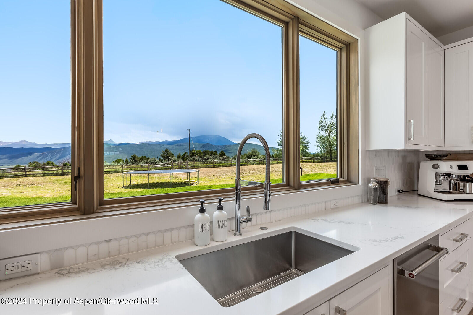 577 Fox Run Drive Carbondale, CO 81623 - Photo 21 of 67 a view of a kitchen with a sink and dishwasher next to a window