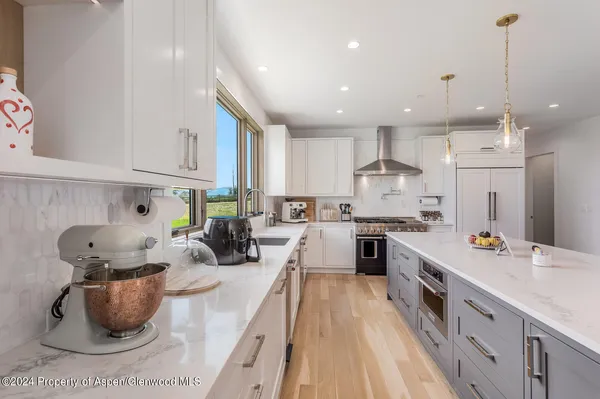 a view of dining room with furniture and wooden floor