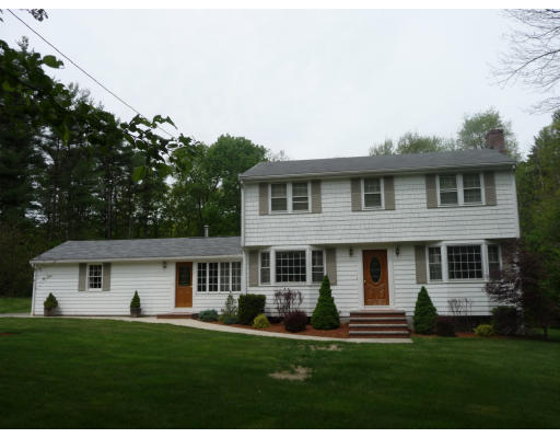 40 Pond Street Boxford, MA 01921 - Photo 1 of 1 a front view of a house with a garden