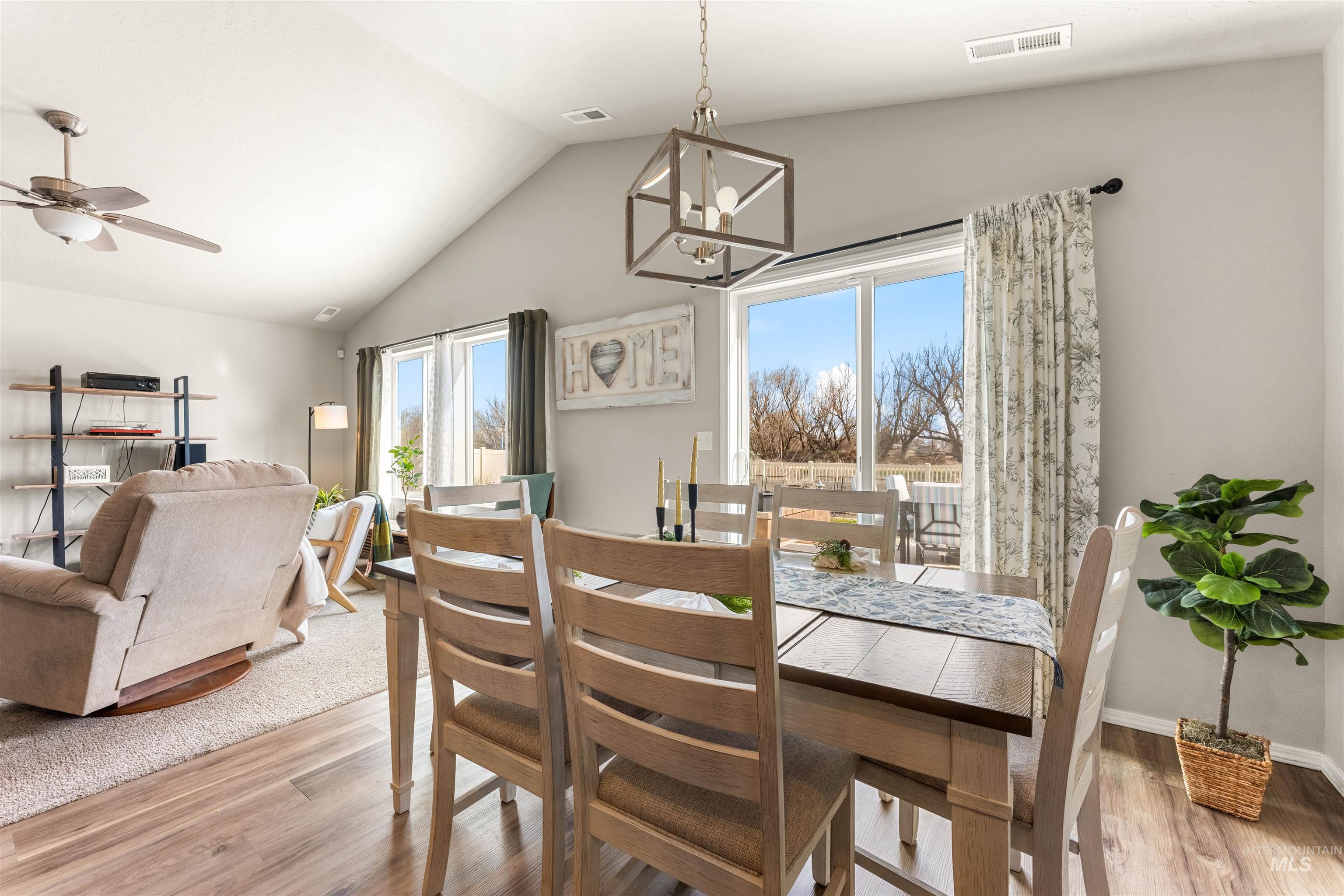 16378 Kelso Way Caldwell, ID 83607 - Photo 15 of 34 Dining space featuring light wood finished floors, suspended lighting, and a ceiling fan