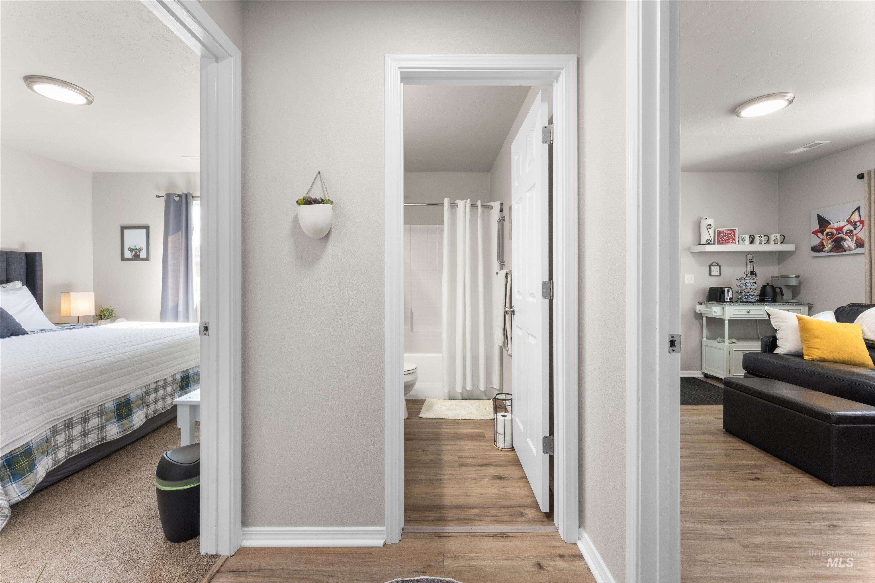 16378 Kelso Way Caldwell, ID 83607 - Photo 26 of 34 Hallway featuring light wood finished floors and baseboards