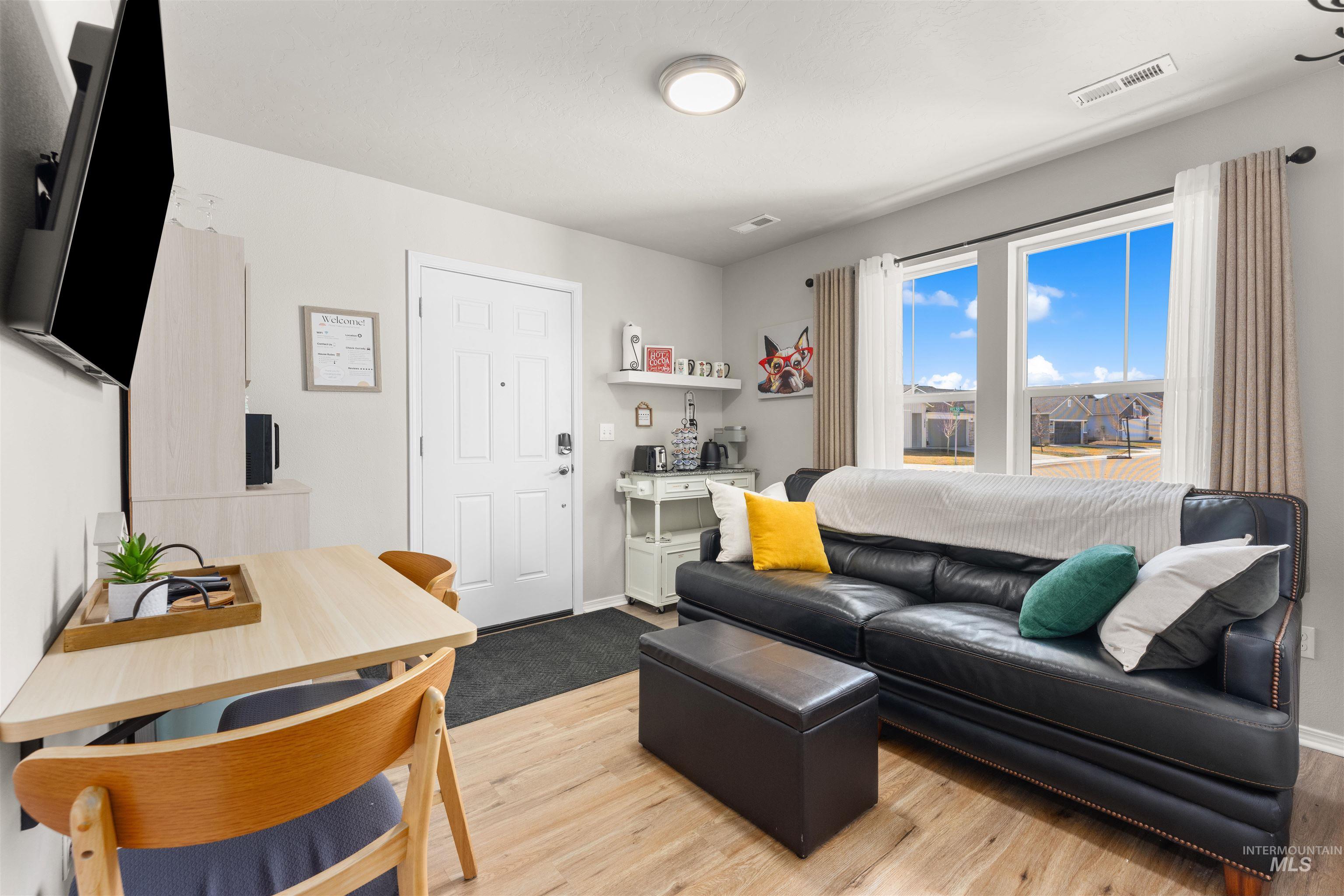16378 Kelso Way Caldwell, ID 83607 - Photo 27 of 34 Living area featuring light wood-style flooring and baseboards