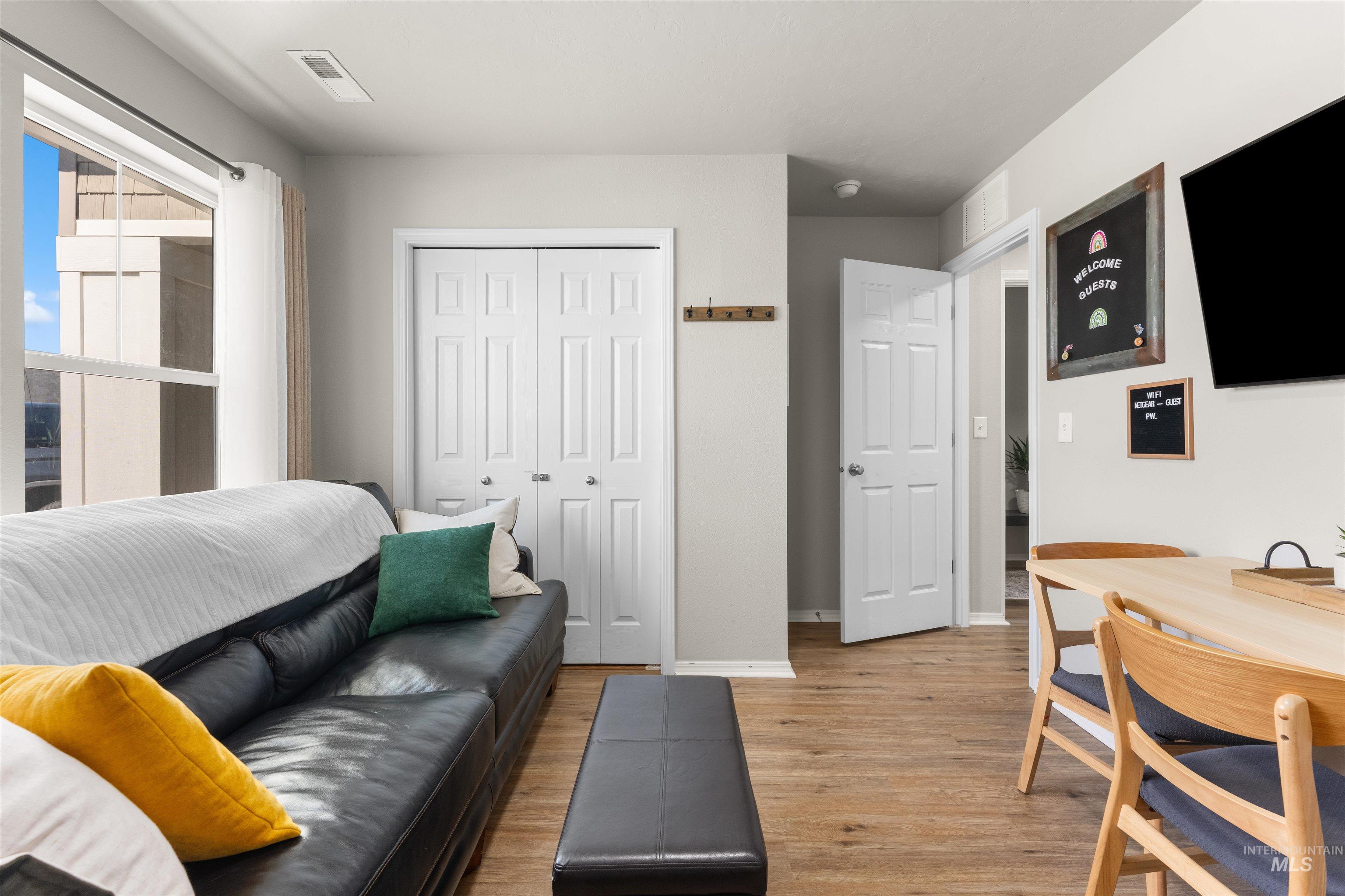 16378 Kelso Way Caldwell, ID 83607 - Photo 29 of 34 Living area featuring light wood-style flooring and baseboards