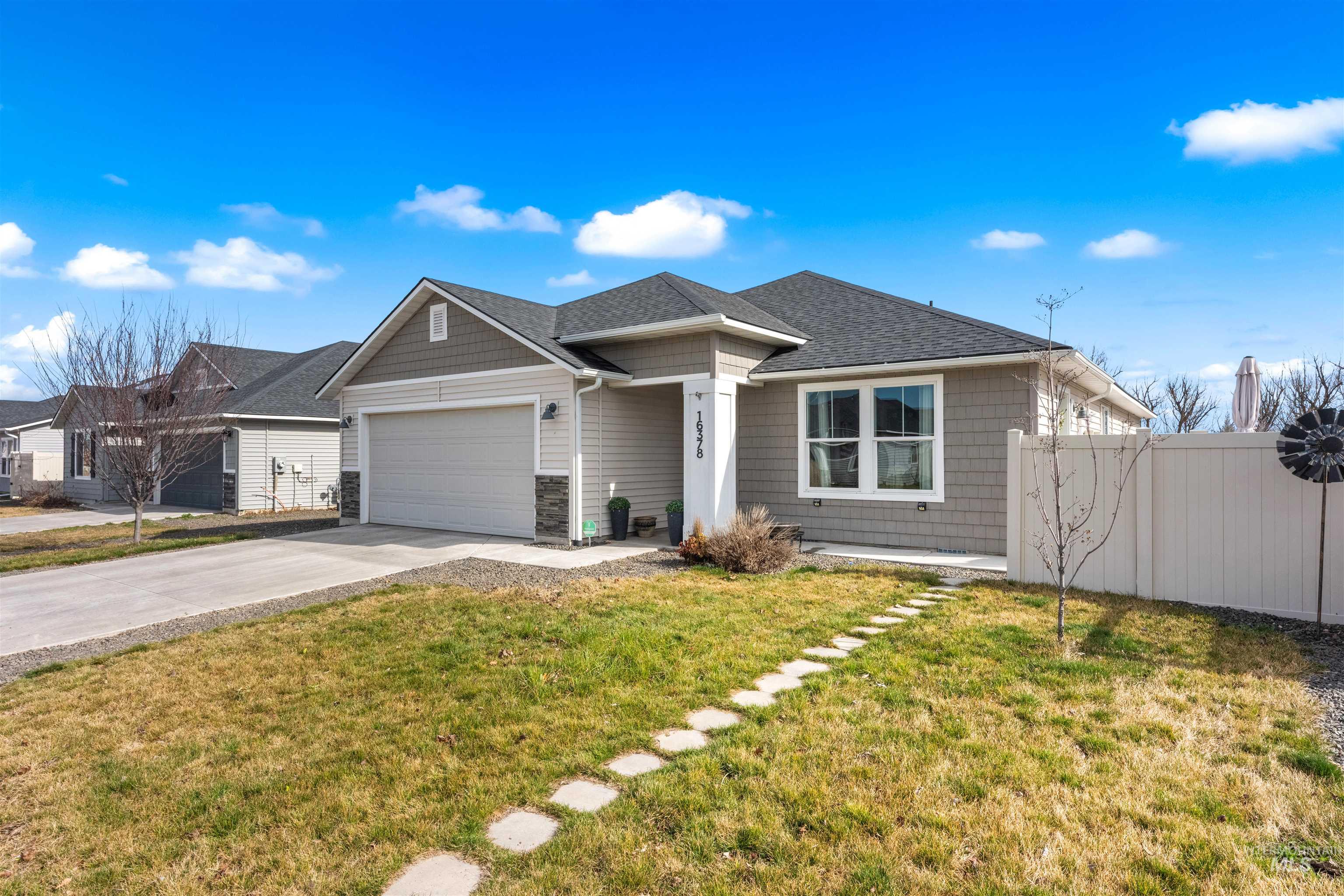 16378 Kelso Way Caldwell, ID 83607 - Photo 3 of 34 View of front of home featuring concrete driveway, a garage, and roof with shingles
