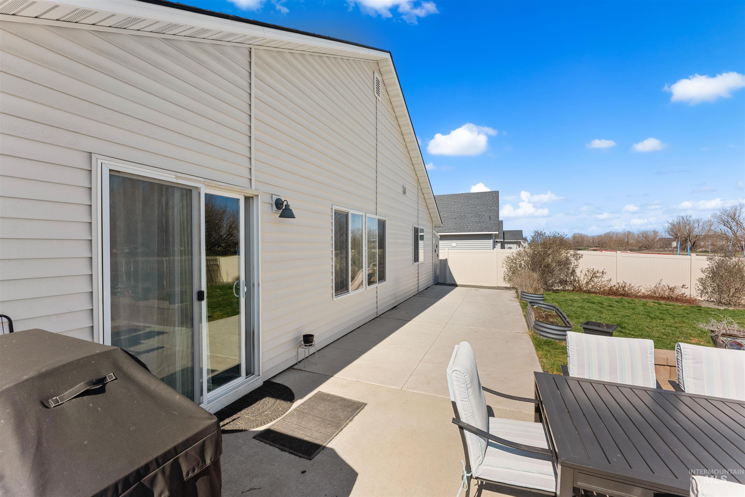 16378 Kelso Way Caldwell, ID 83607 - Photo 33 of 34 Fenced backyard featuring a patio area, area for grilling, and outdoor dining area