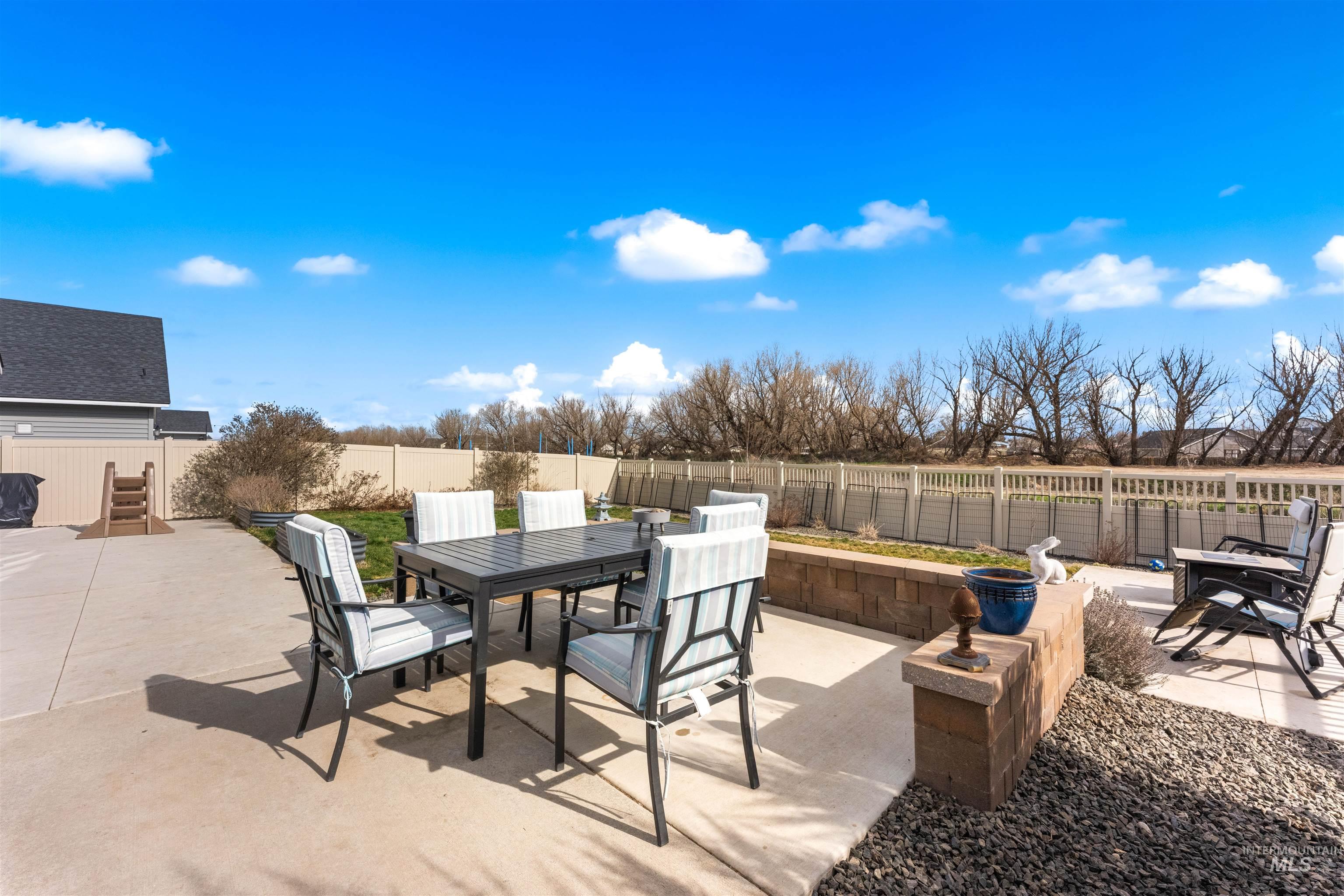 16378 Kelso Way Caldwell, ID 83607 - Photo 6 of 34 Fenced backyard with outdoor dining space and a patio
