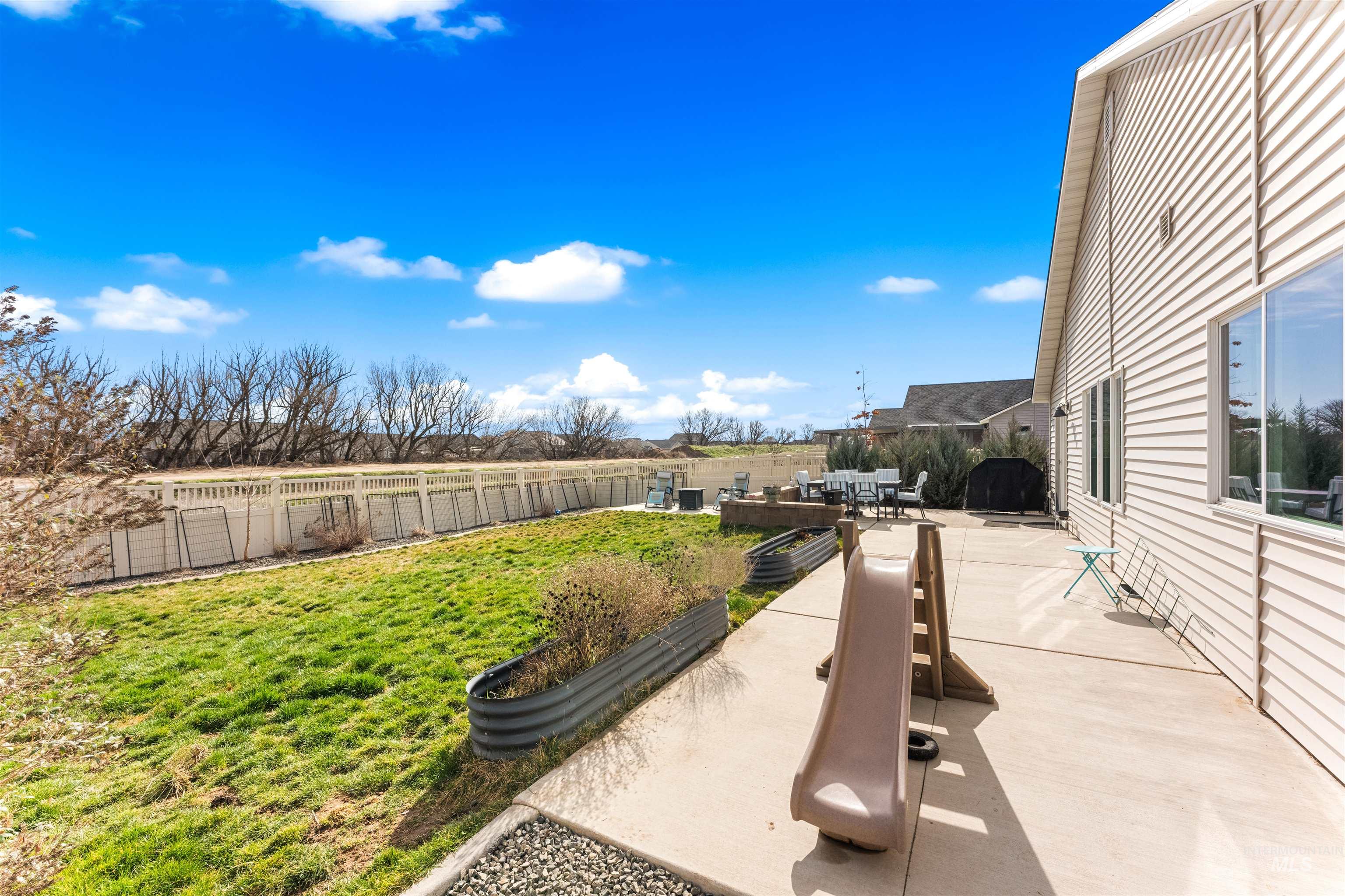 16378 Kelso Way Caldwell, ID 83607 - Photo 8 of 34 Fenced backyard featuring a patio and outdoor dining area