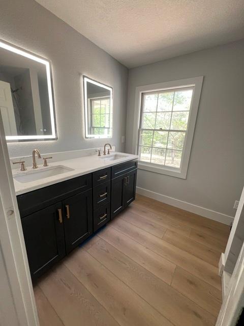 1616 Abe Cove Road Hiawassee, GA 30546 - Photo 12 of 17 a spacious bathroom with double vanity and a large mirror