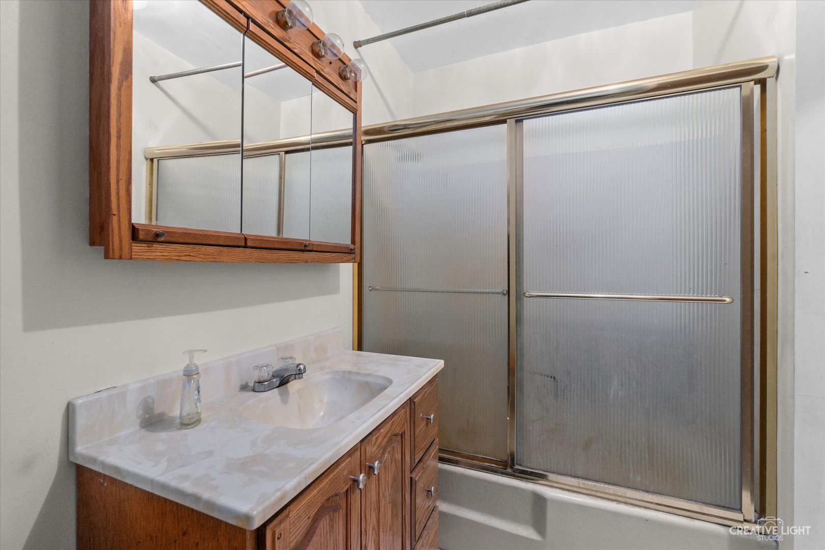 9956 Rimsnider Road Hinckley, IL 60520 - Photo 11 of 22 a bathroom with a sink and a shower
