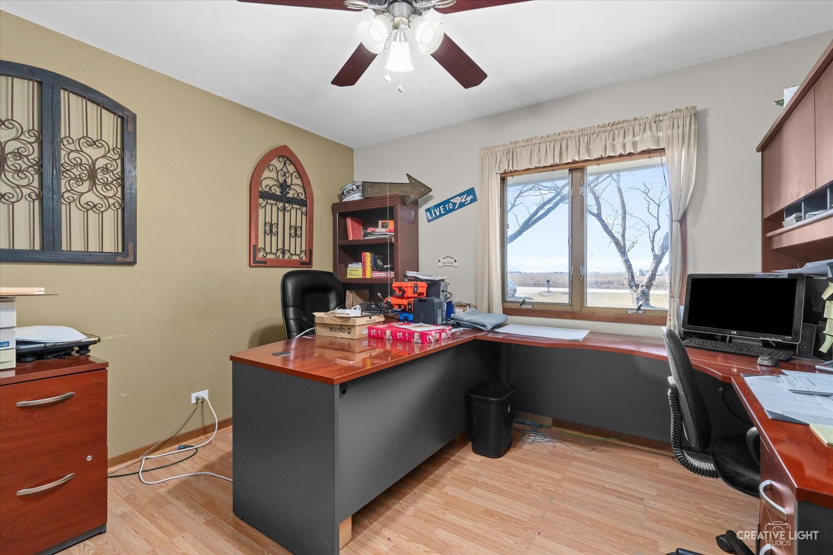 9956 Rimsnider Road Hinckley, IL 60520 - Photo 12 of 22 a view of a workspace with furniture and a window