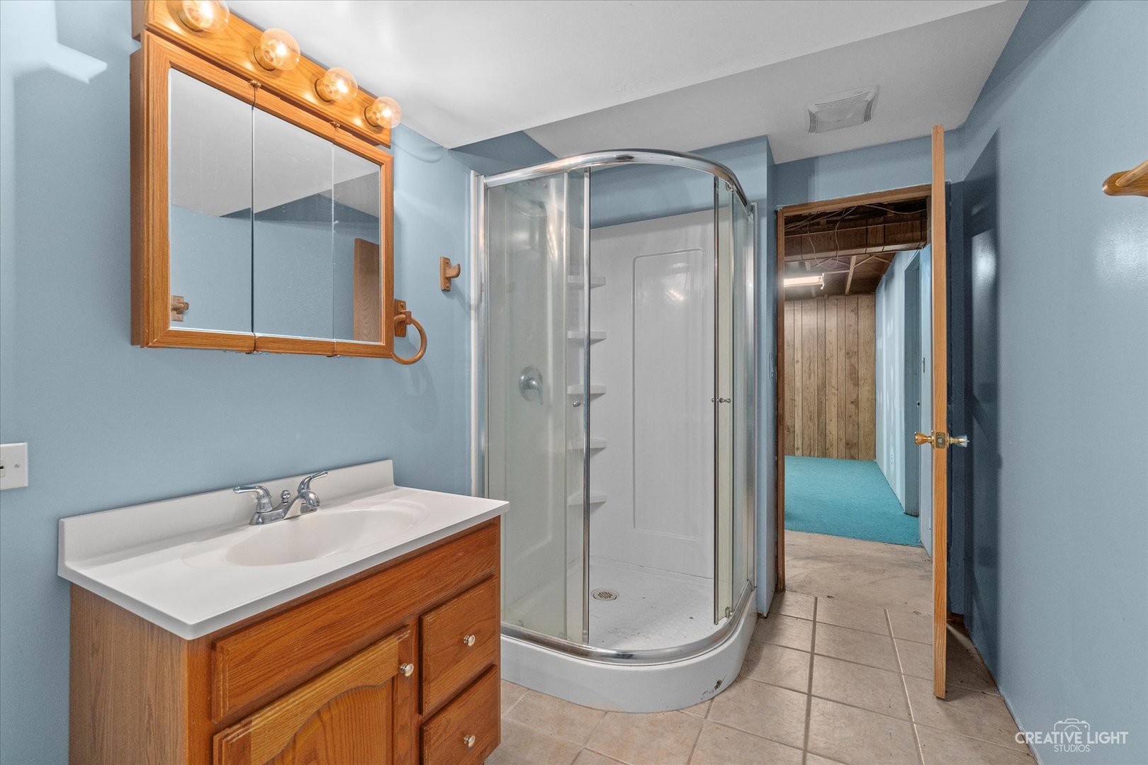 9956 Rimsnider Road Hinckley, IL 60520 - Photo 16 of 22 a bathroom with a sink a toilet and shower