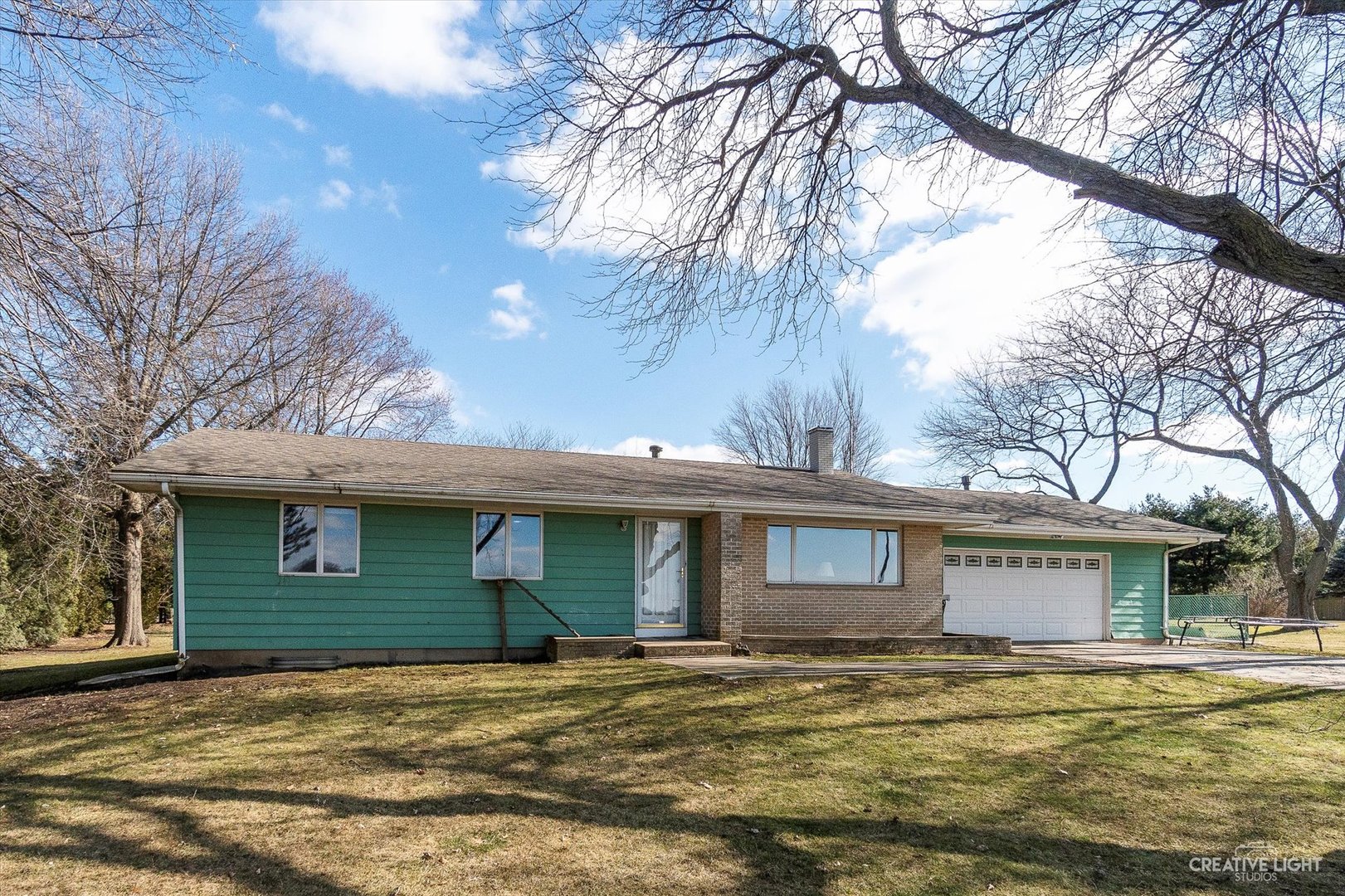 9956 Rimsnider Road Hinckley, IL 60520 - Photo 2 of 22 a front view of a house with a garden