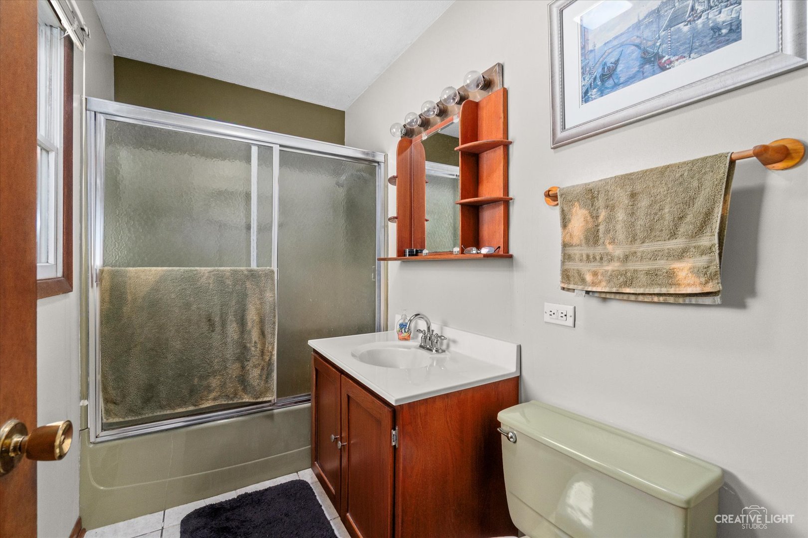 9956 Rimsnider Road Hinckley, IL 60520 - Photo 9 of 22 a bathroom with a sink toilet and shower