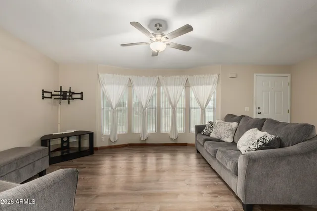 a living room with furniture and a large window