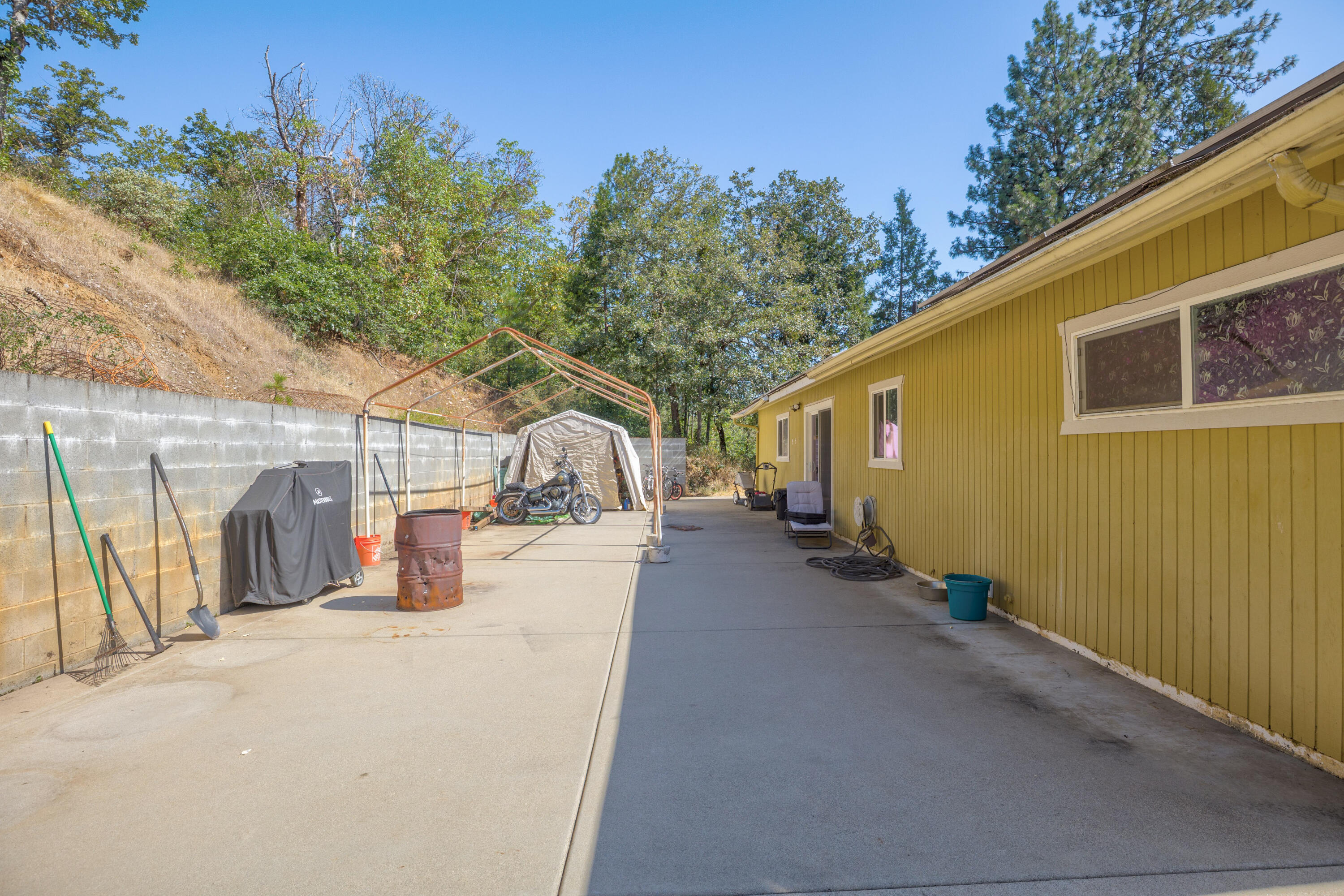 12748 Water Gap Road Williams, OR 97544 - Photo 20 of 35 a view of a house with backyard and sitting area