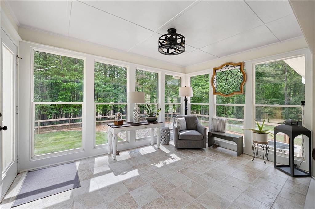 687 Cotton Road Canton, GA 30115 - Photo 11 of 38 a living room with furniture and large windows