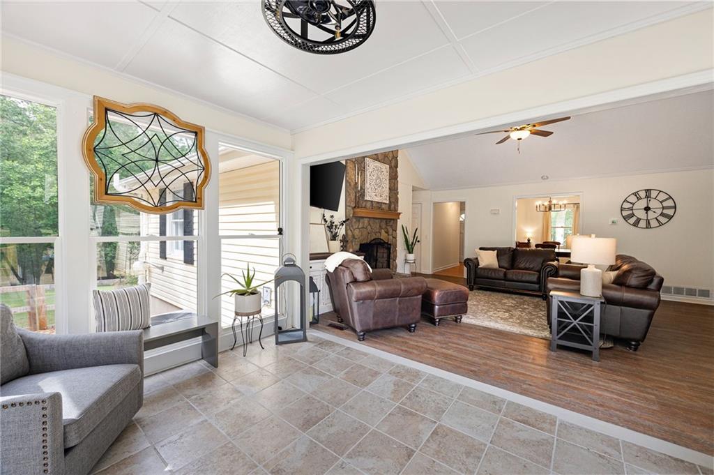 687 Cotton Road Canton, GA 30115 - Photo 12 of 38 a living room with furniture and a large window