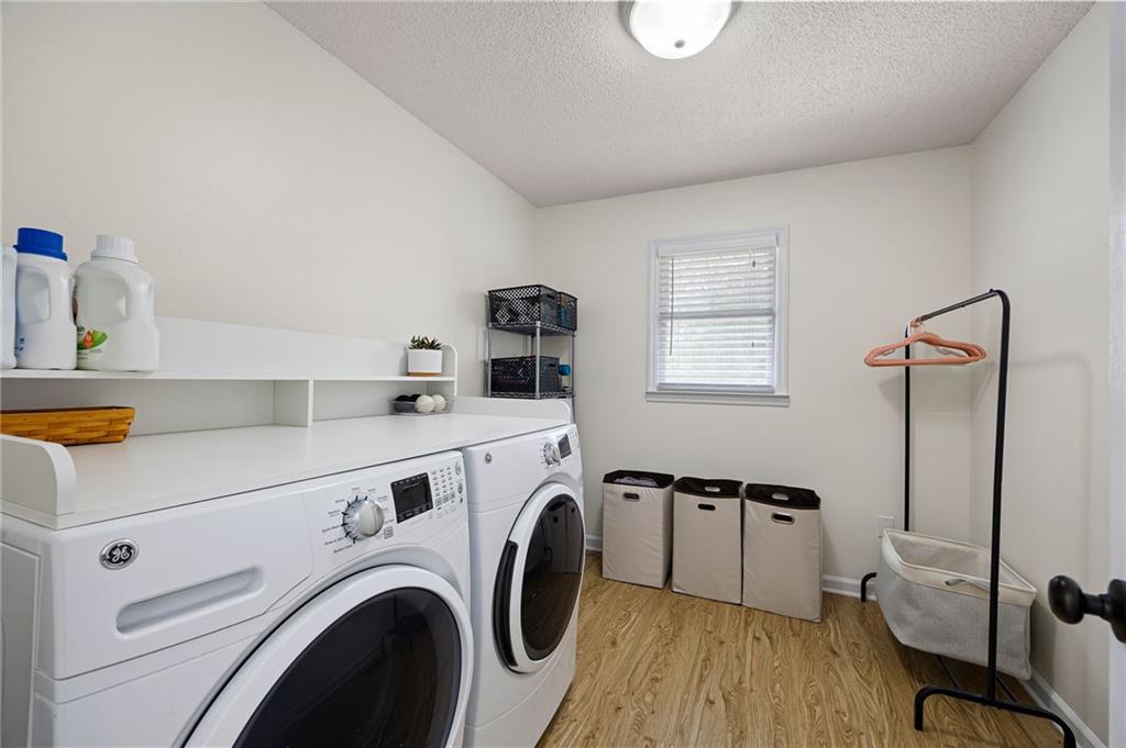 687 Cotton Road Canton, GA 30115 - Photo 25 of 38 a utility room with dryer and washer