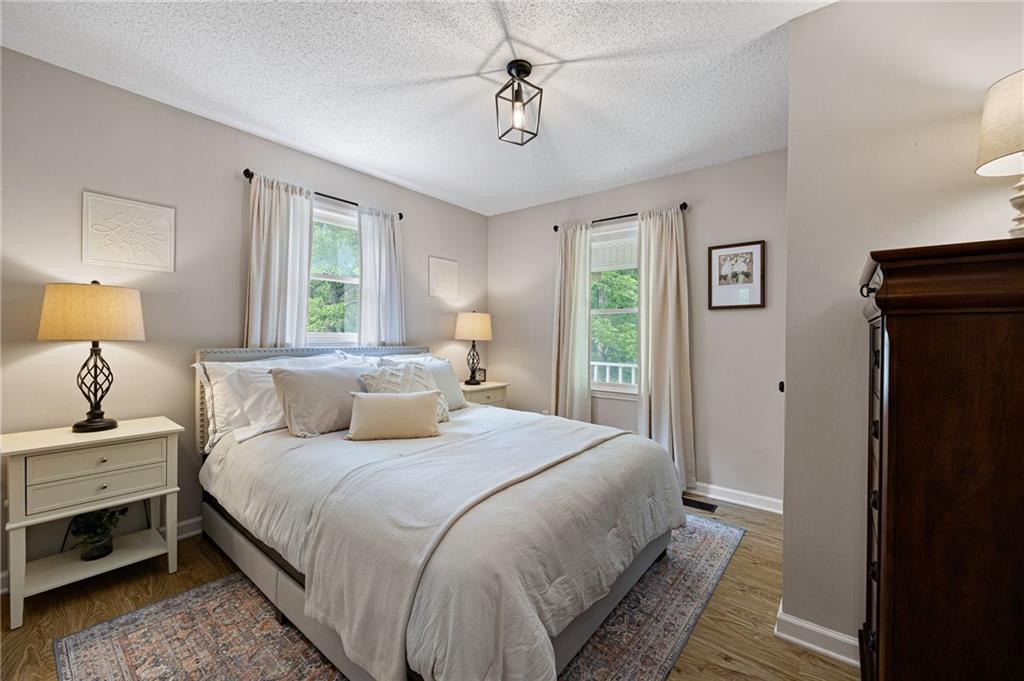 687 Cotton Road Canton, GA 30115 - Photo 26 of 38 a bedroom with a bed and a dresser