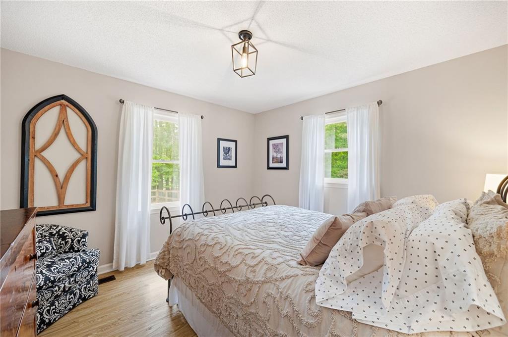 687 Cotton Road Canton, GA 30115 - Photo 28 of 38 a bedroom with a bed and a window