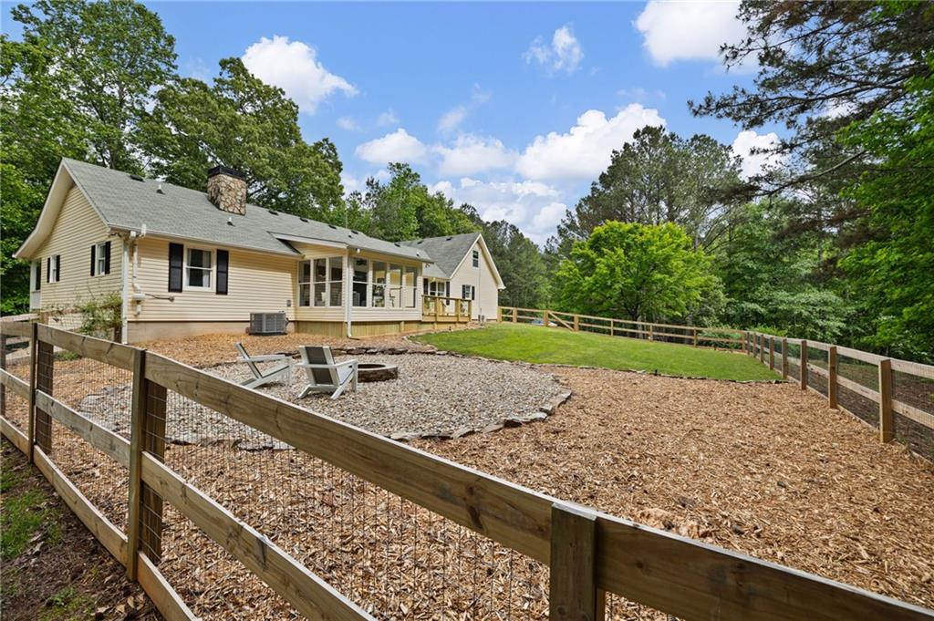687 Cotton Road Canton, GA 30115 - Photo 36 of 38 a view of a house with a wooden deck