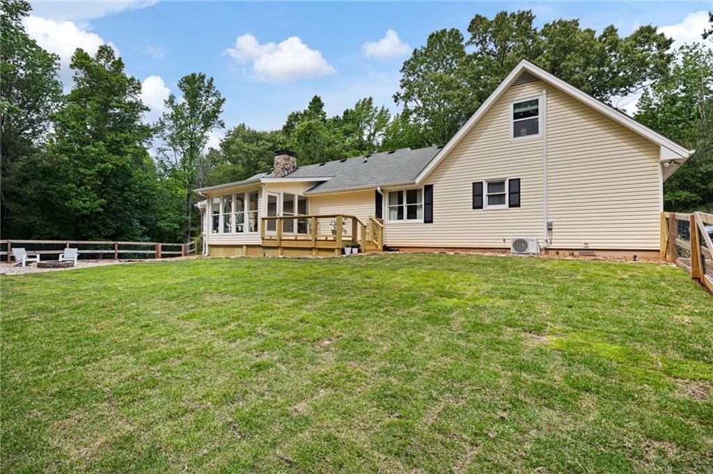 687 Cotton Road Canton, GA 30115 - Photo 38 of 38 a view of a house with a yard and sitting area