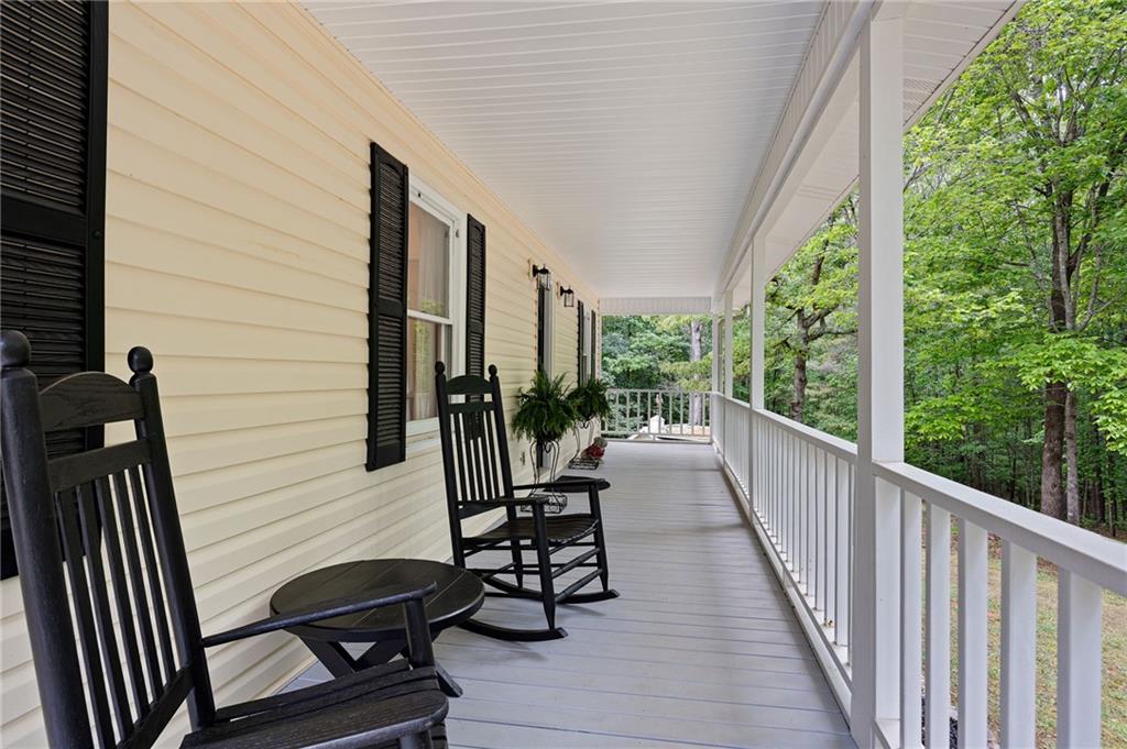 687 Cotton Road Canton, GA 30115 - Photo 4 of 38 a view of a balcony with chairs