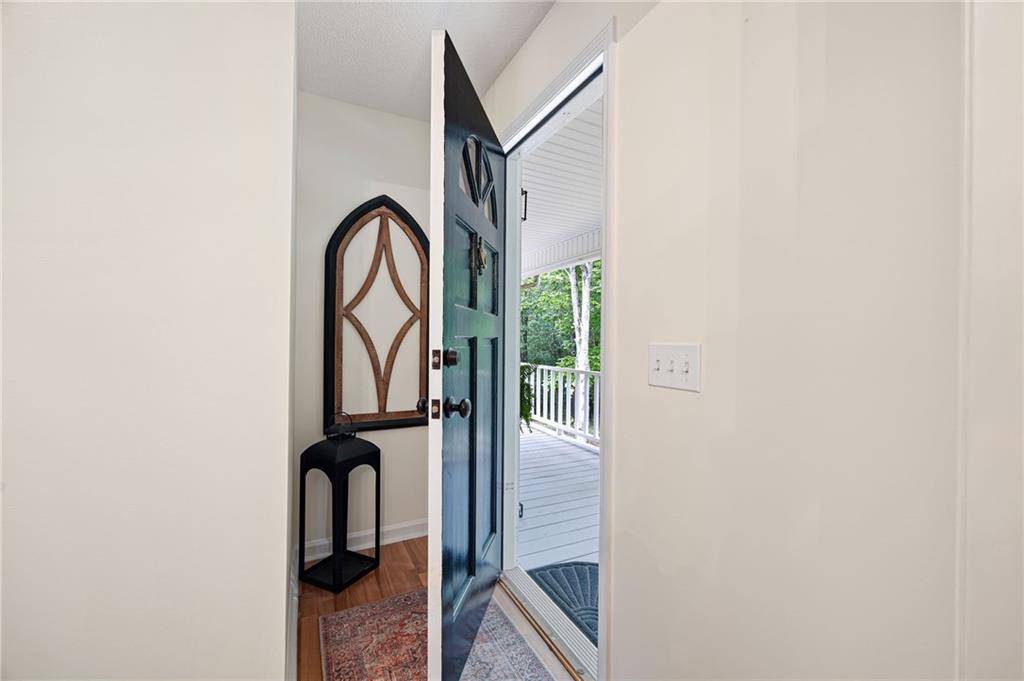 687 Cotton Road Canton, GA 30115 - Photo 6 of 38 a view of staircase with a rug