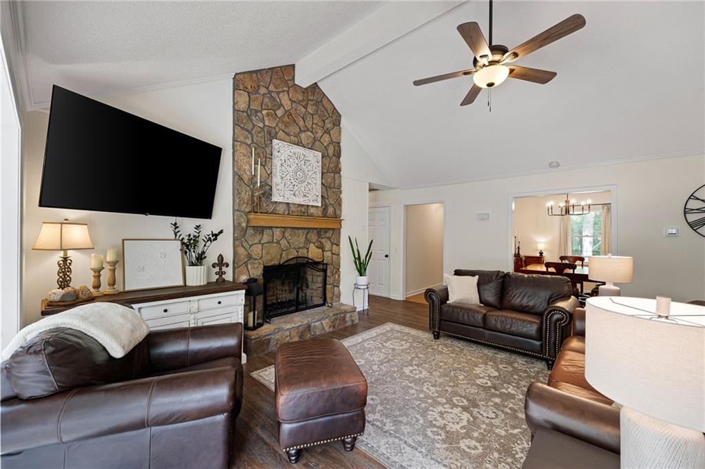687 Cotton Road Canton, GA 30115 - Photo 9 of 38 a living room with furniture fireplace and a flat screen tv