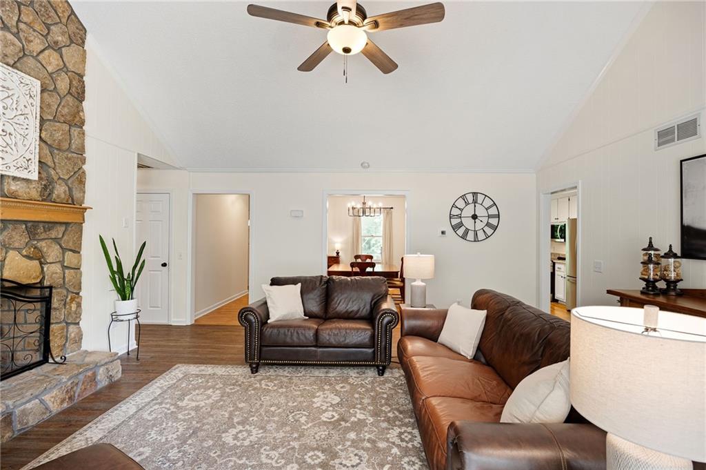 687 Cotton Road Canton, GA 30115 - Photo 10 of 38 a living room with furniture and a rug