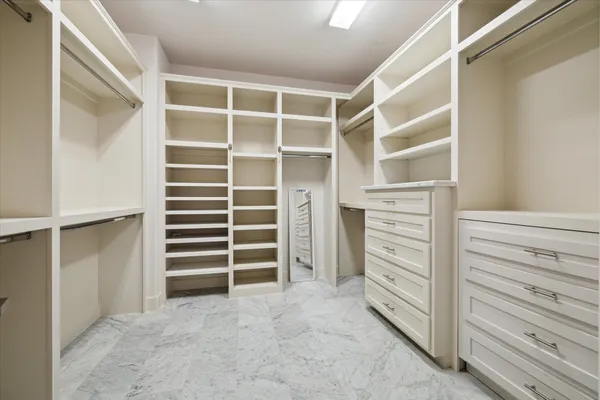 a view of walk in closet and stairs