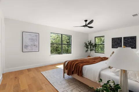 a bedroom with bed and window