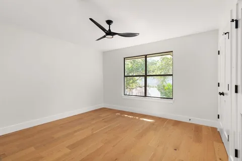 a bathroom with a double vanity sink and mirror