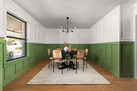 a dining room with furniture and window