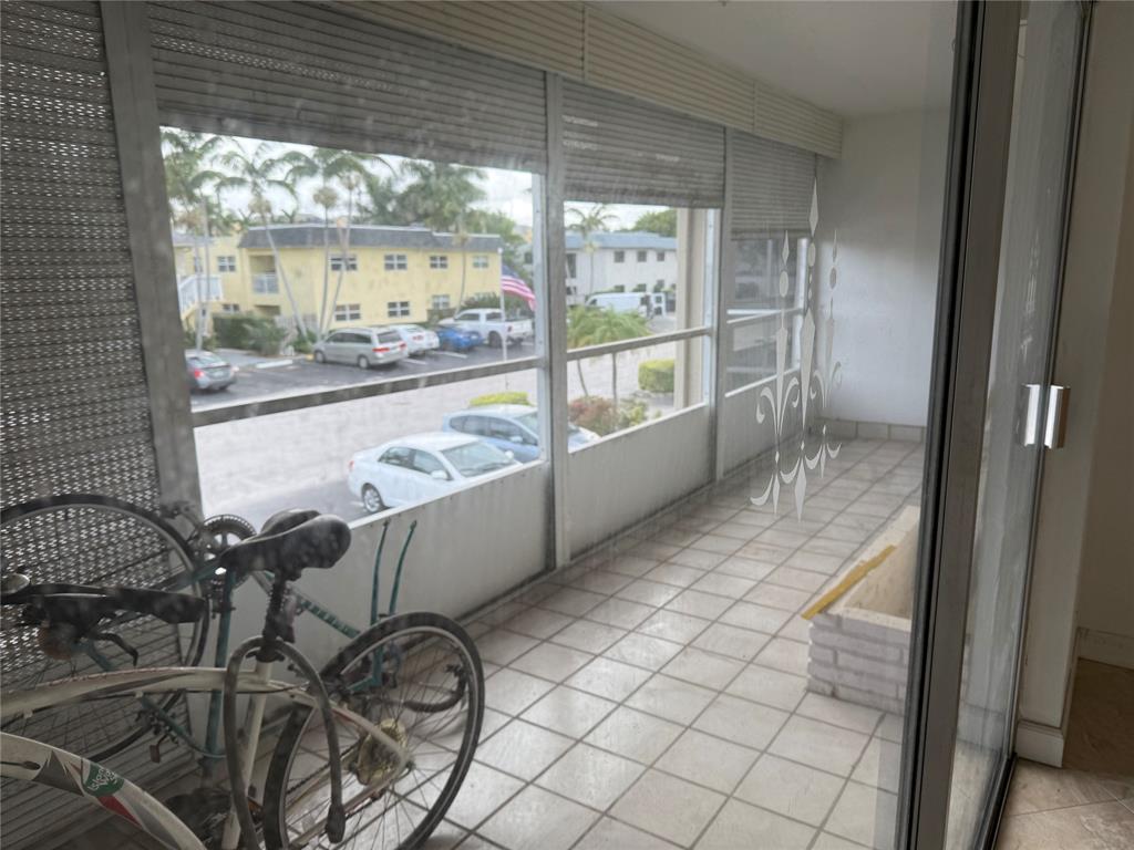 2131 Northeast 42nd Court, Unit 202E Lighthouse Point, FL 33064 - Photo 13 of 22 a view of a room with window