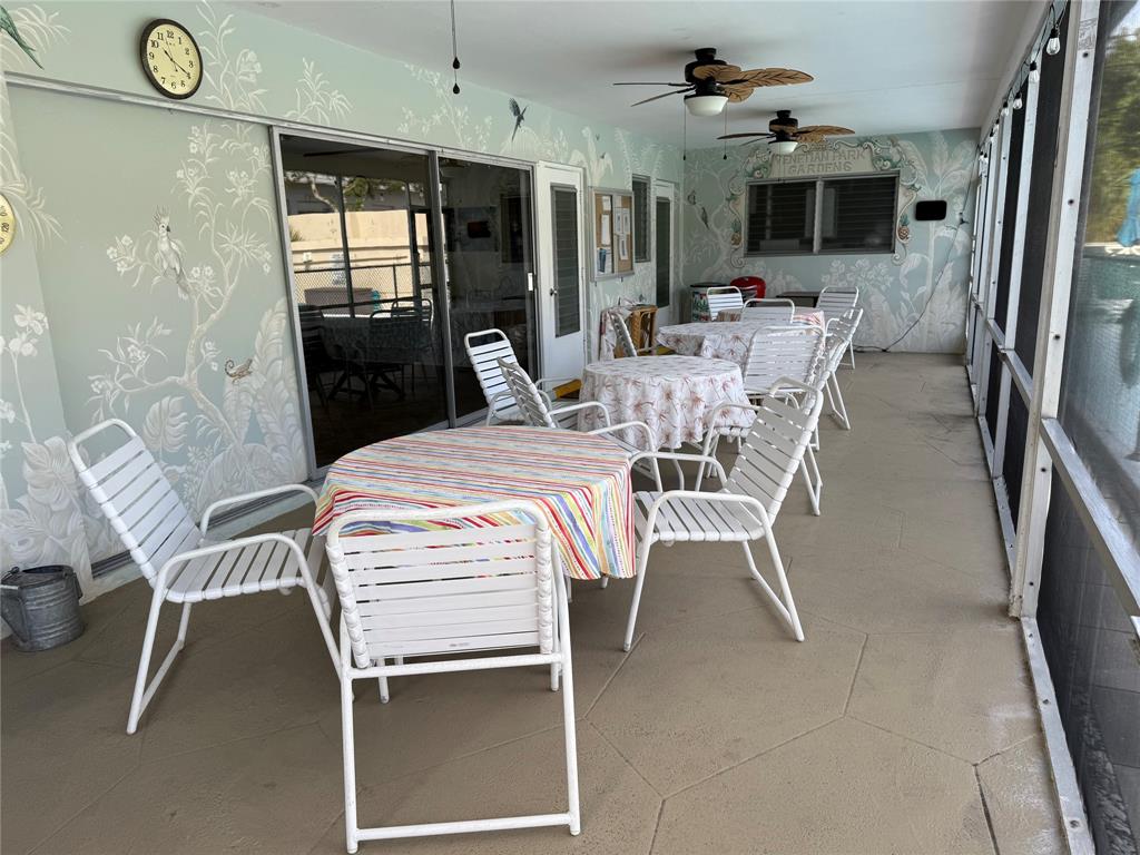 2131 Northeast 42nd Court, Unit 202E Lighthouse Point, FL 33064 - Photo 22 of 22 a dining room with furniture and window