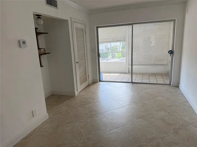 a view of an empty room and window