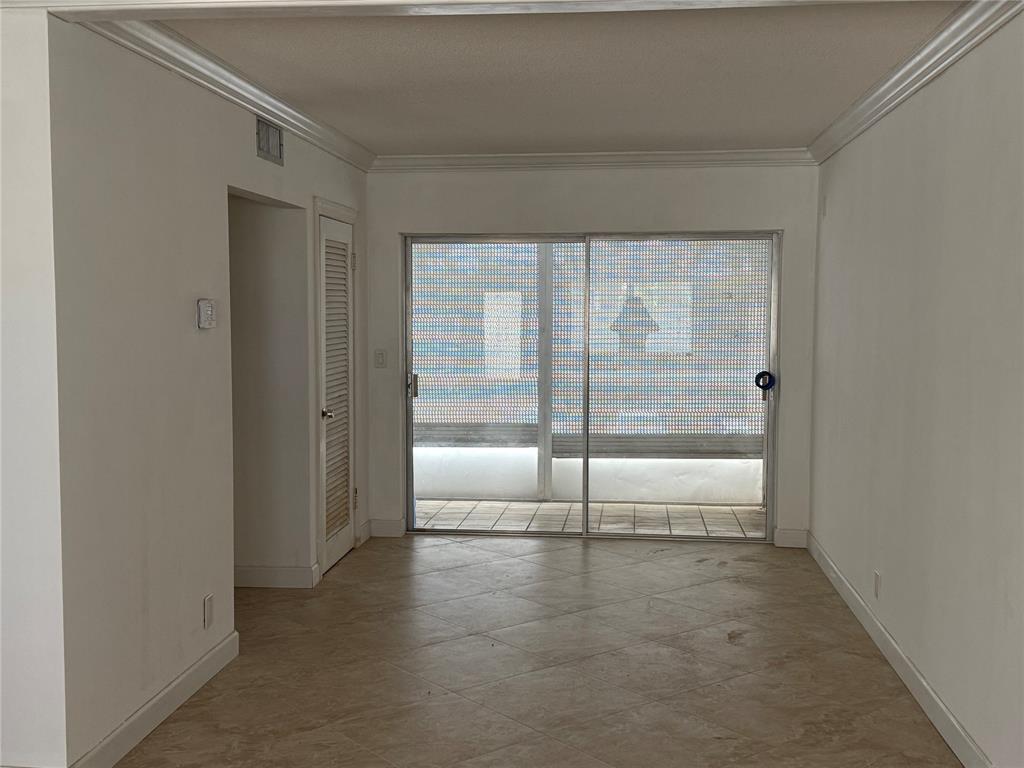 2131 Northeast 42nd Court, Unit 202E Lighthouse Point, FL 33064 - Photo 5 of 22 a view of an empty room and window