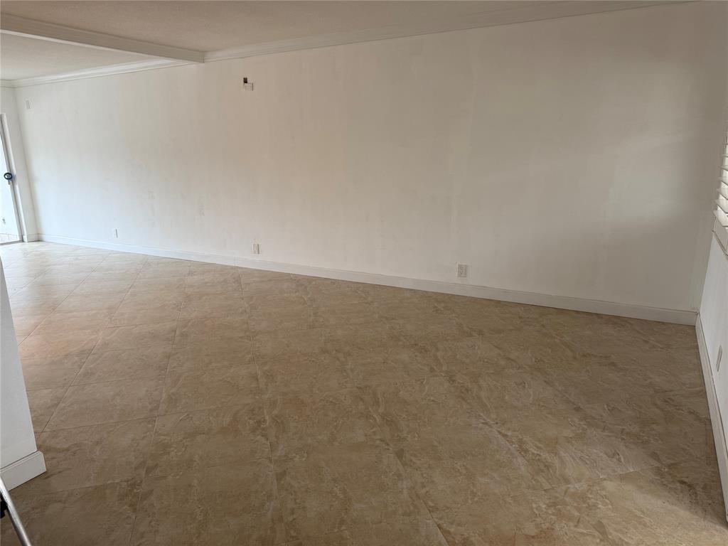 2131 Northeast 42nd Court, Unit 202E Lighthouse Point, FL 33064 - Photo 7 of 22 a view of an empty room