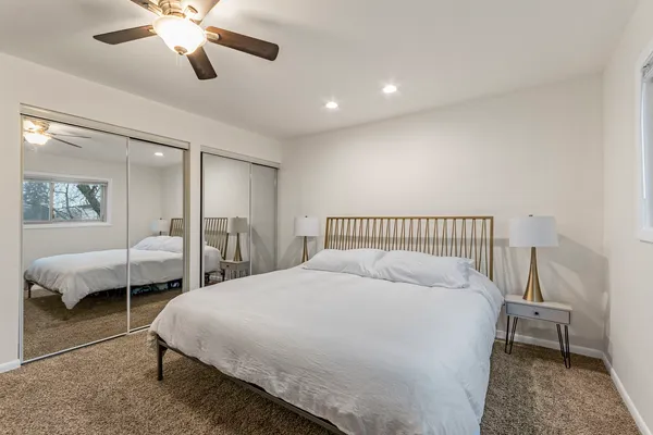 a bedroom with bed and a window