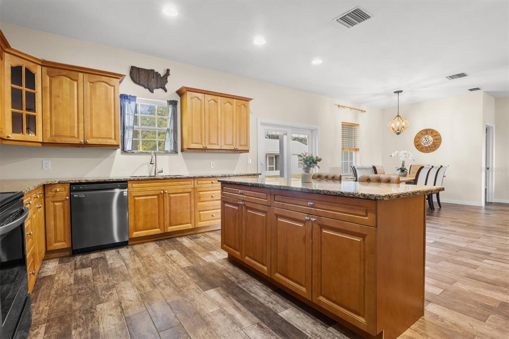 4020 Connersville Road Bartow, FL 33830 - Photo 15 of 50 a kitchen with a sink stove and cabinets