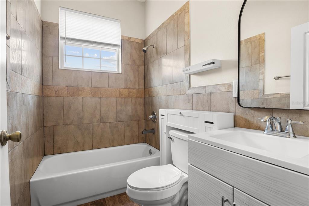 4020 Connersville Road Bartow, FL 33830 - Photo 16 of 50 a bathroom with a sink toilet and shower