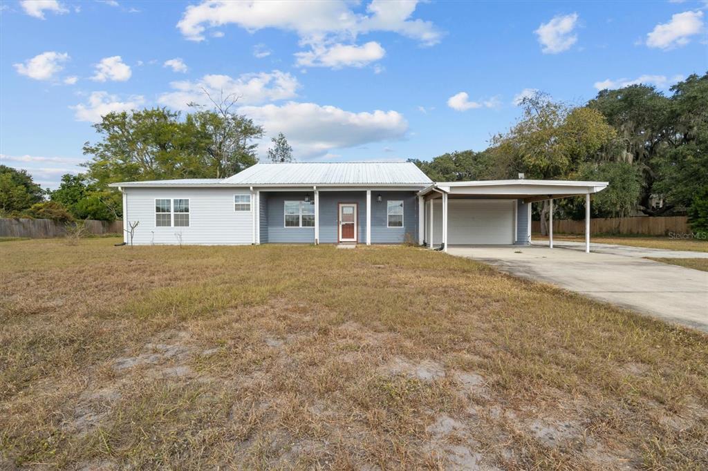 4020 Connersville Road Bartow, FL 33830 - Photo 2 of 50 a front view of house with yard and trees around