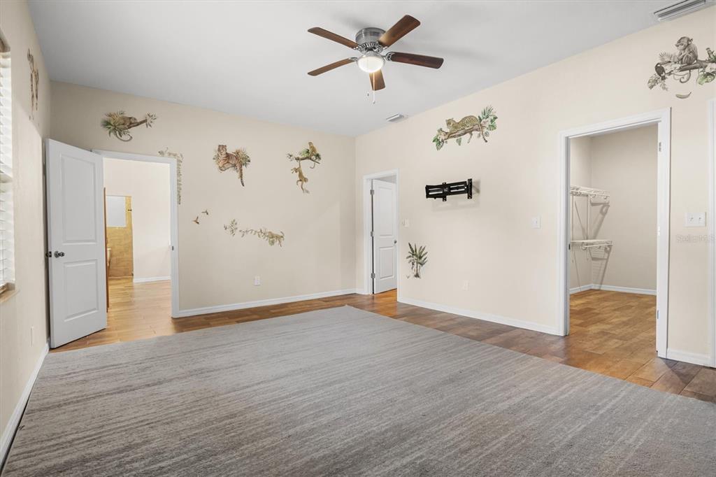 4020 Connersville Road Bartow, FL 33830 - Photo 21 of 50 a view of empty room with wooden floor and ceiling fan